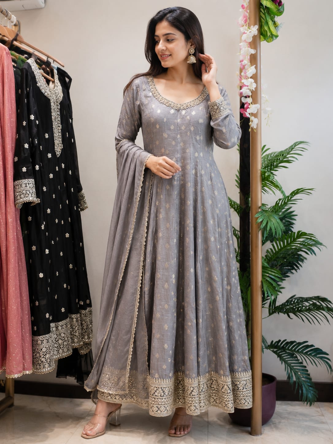 Bespoke tailored indowwestern partywear silhouettes hanging in showrooms